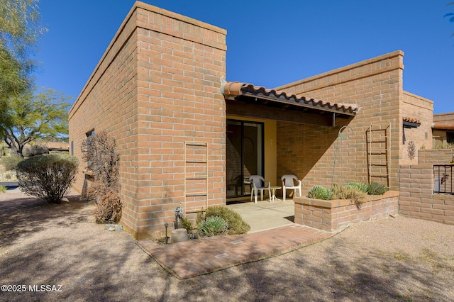 back of house with a patio area