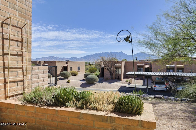 exterior space with a carport and a mountain view