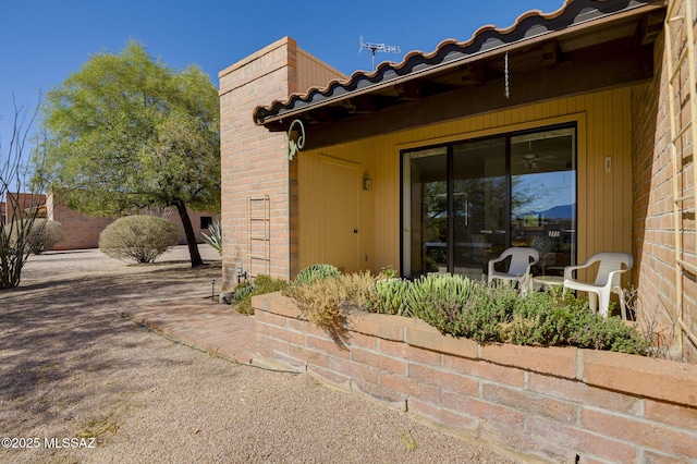 view of property exterior with a patio area