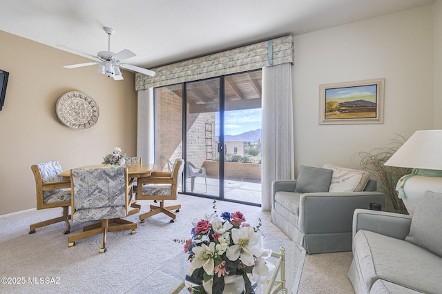 living room with light carpet and ceiling fan