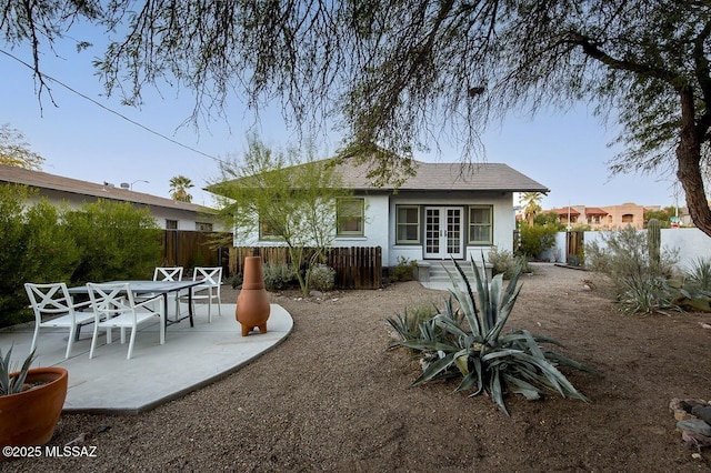 rear view of property featuring a patio area