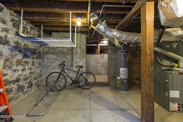 basement with water heater and heating unit