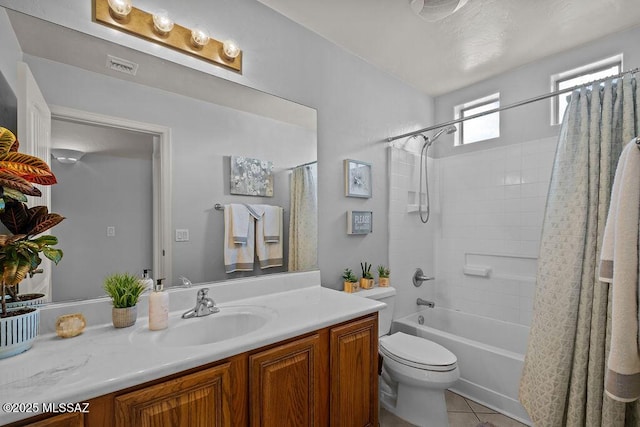 full bathroom with toilet, tile patterned flooring, vanity, and shower / bath combination with curtain