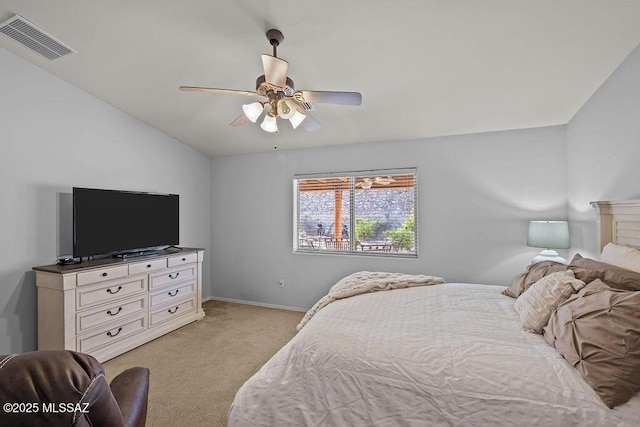 bedroom featuring lofted ceiling, ceiling fan, and light colored carpet
