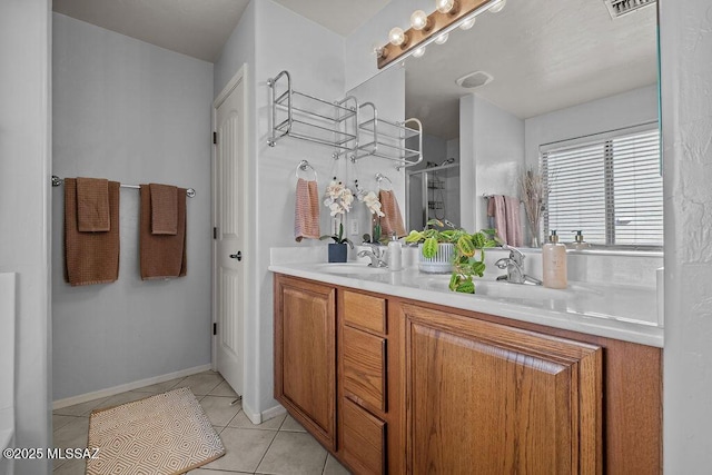 bathroom featuring vanity, an enclosed shower, and tile patterned floors