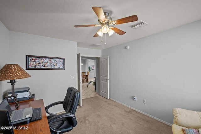 home office with ceiling fan and light colored carpet