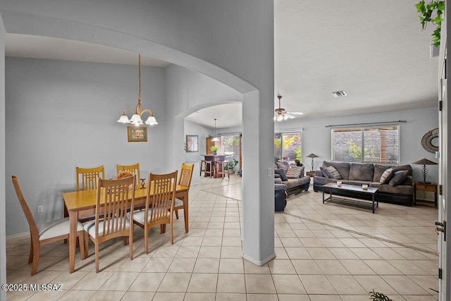 dining area with a notable chandelier and light tile patterned floors