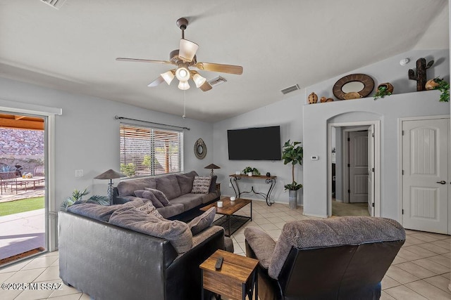 tiled living room featuring ceiling fan and vaulted ceiling