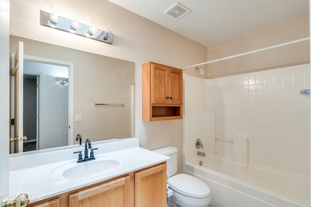 full bathroom with vanity, bathing tub / shower combination, and toilet