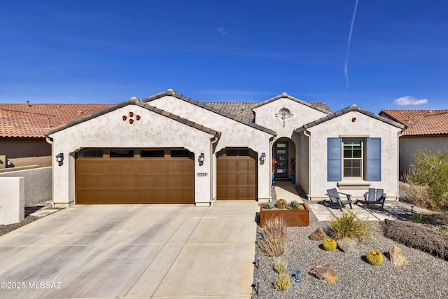 mediterranean / spanish house featuring a garage