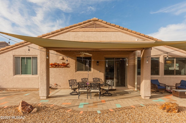 rear view of house featuring a patio area