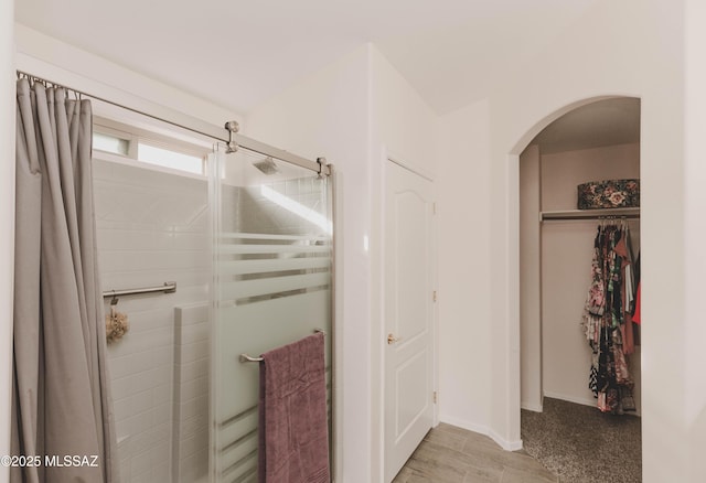 bathroom featuring an enclosed shower