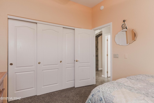 carpeted bedroom featuring a closet