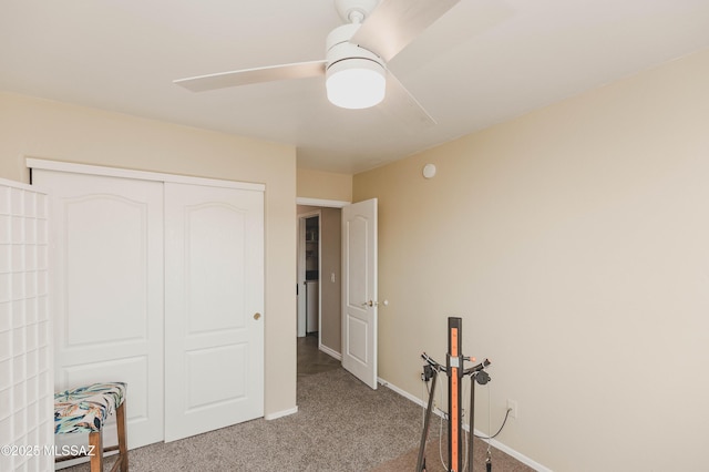 bedroom with a closet, ceiling fan, and carpet flooring