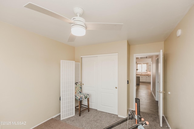 bedroom featuring ceiling fan, carpet floors, and a closet