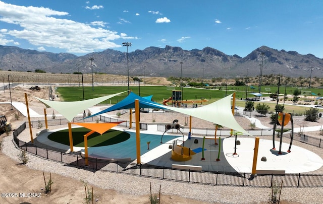 view of community featuring a mountain view and a playground