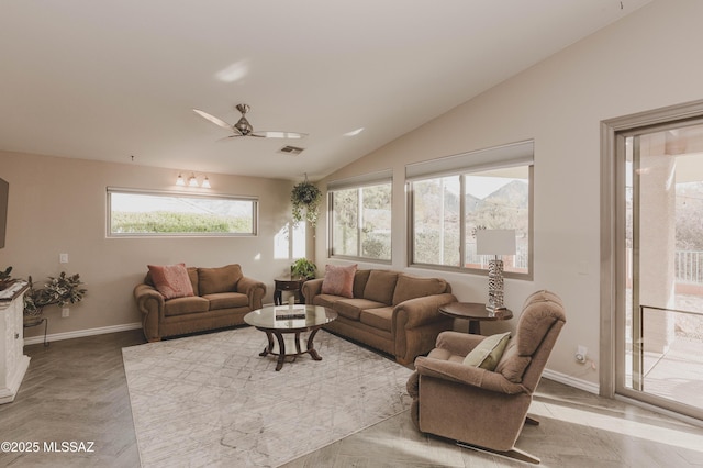 living room featuring vaulted ceiling, light parquet flooring, and ceiling fan