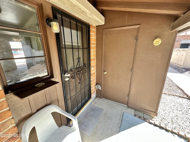 entrance to property with brick siding