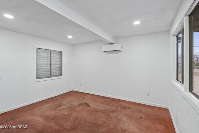 empty room featuring recessed lighting, a wall mounted air conditioner, and baseboards