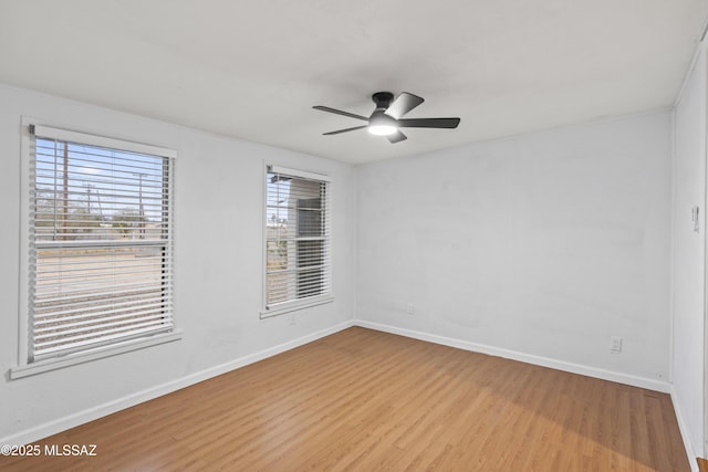 unfurnished room with light hardwood / wood-style flooring and ceiling fan