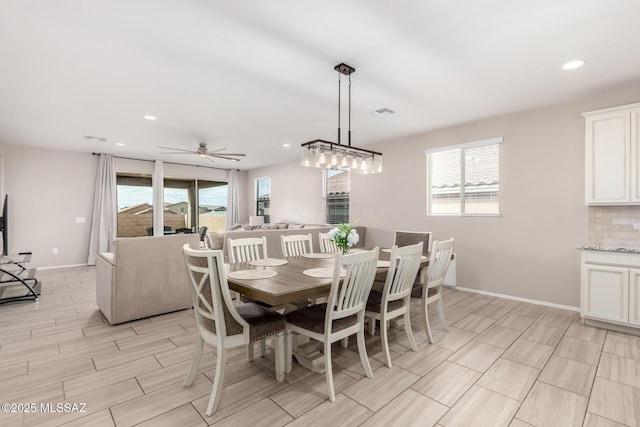 dining space featuring ceiling fan and plenty of natural light