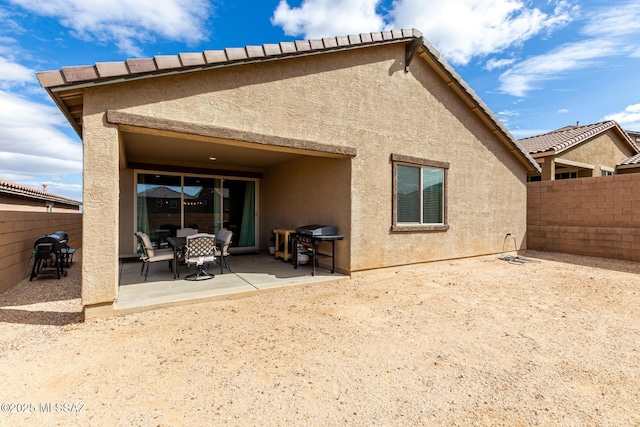 rear view of house with a patio area