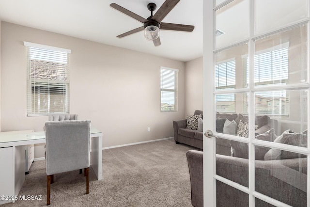 office area with ceiling fan and carpet flooring