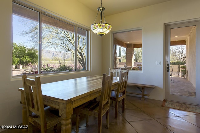 dining area with tile patterned flooring