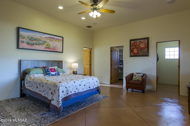 tiled bedroom with ceiling fan