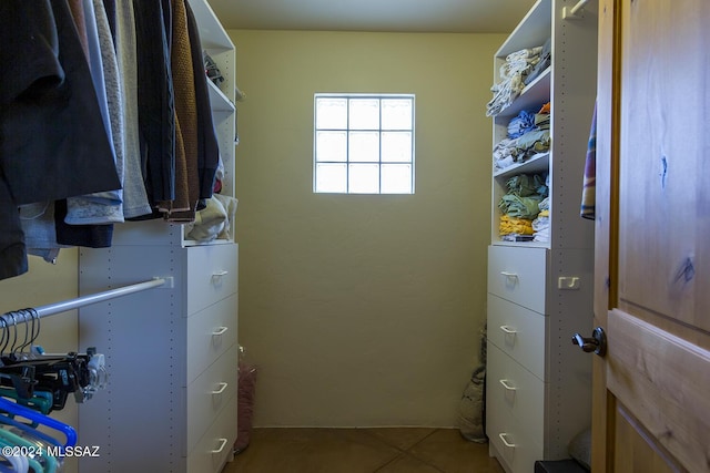 spacious closet with tile patterned flooring