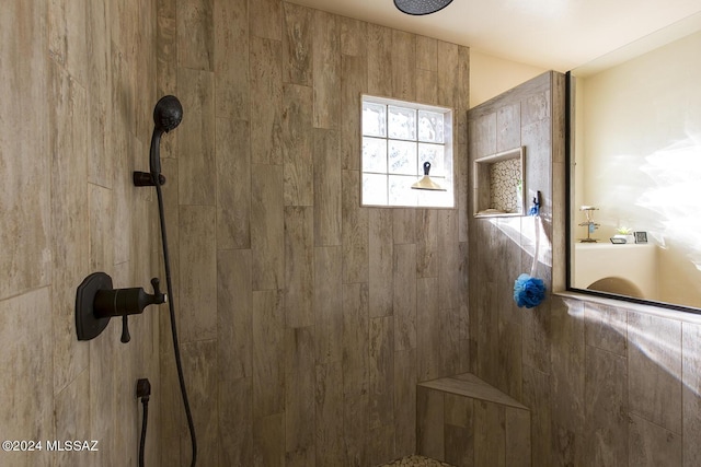 bathroom featuring a tile shower