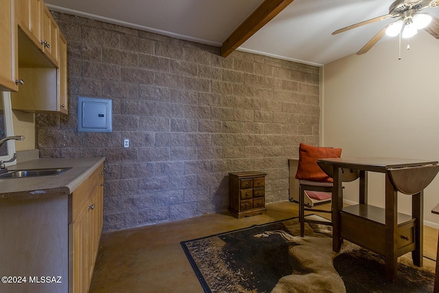 interior space with light brown cabinetry, sink, electric panel, ceiling fan, and beam ceiling