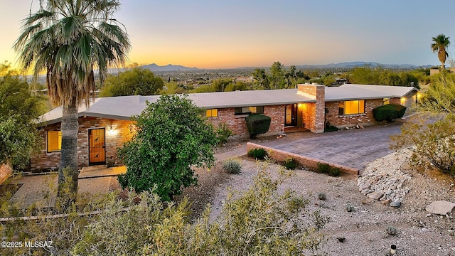 single story home with a mountain view