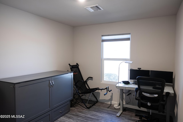 office space featuring dark wood-style floors and visible vents