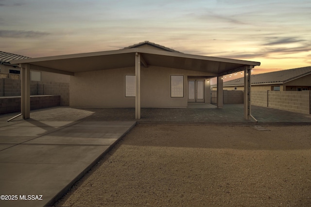 1599 W Cottonwood Bluffs Dr, Benson, AZ 85602 - view of front of property with stucco siding and a patio