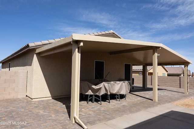 view of patio featuring fence
