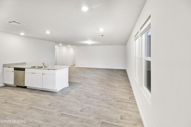 1599 W Cottonwood Bluffs Dr, Benson, AZ 85602 - kitchen featuring white cabinetry, a sink, recessed lighting, open floor plan, and dishwasher