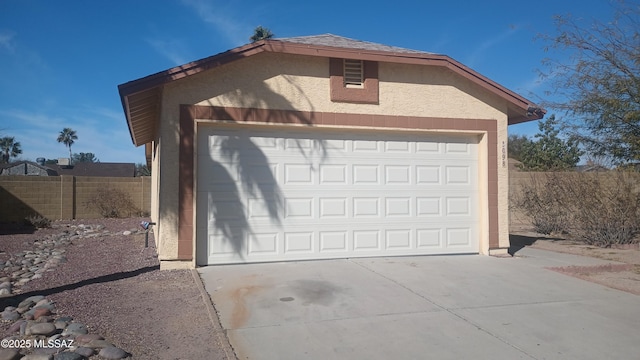 garage with fence