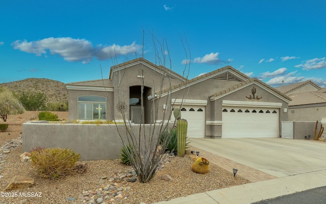 view of front of home featuring a mountain view and a garage