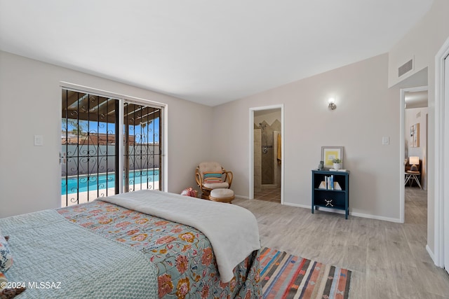 bedroom with access to exterior, light hardwood / wood-style floors, and ensuite bathroom