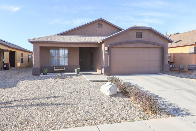 view of front of home with a garage