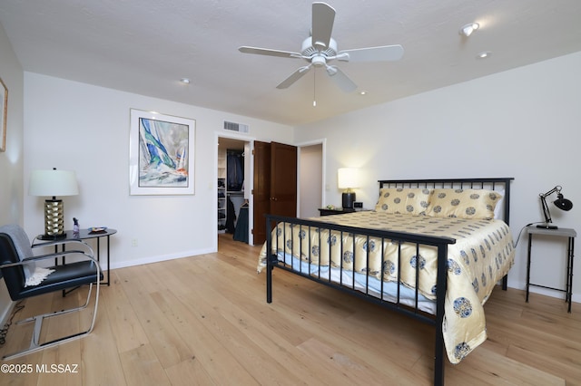 bedroom featuring ceiling fan and light hardwood / wood-style floors