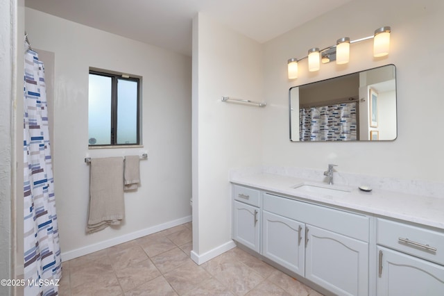 bathroom with vanity and tile patterned flooring