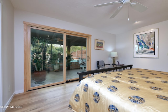 bedroom featuring hardwood / wood-style flooring, ceiling fan, and access to outside