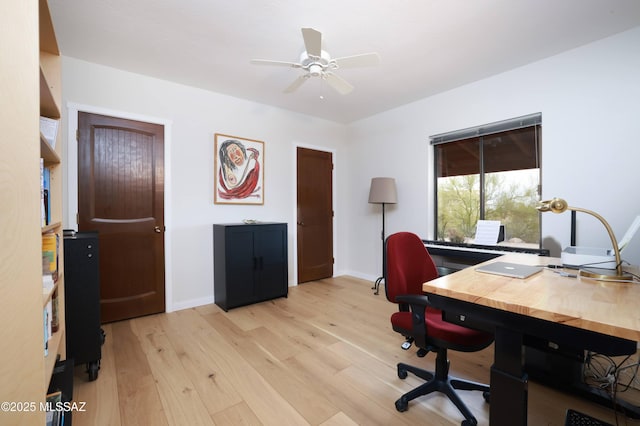 office space with ceiling fan and light hardwood / wood-style floors