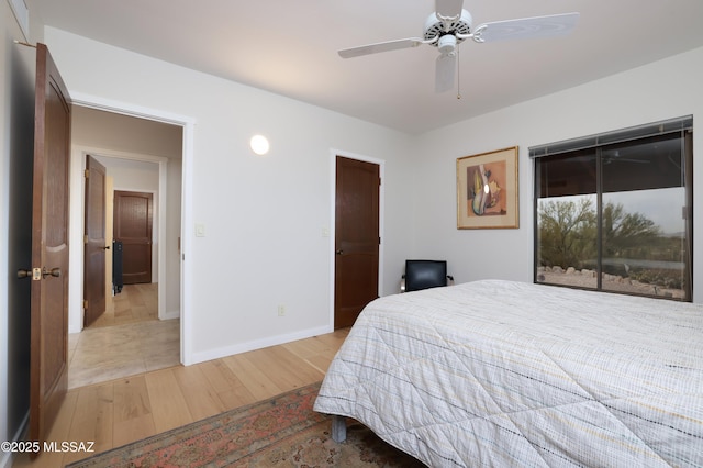 bedroom with light hardwood / wood-style flooring and ceiling fan