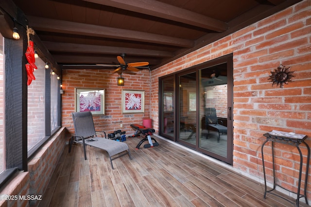 deck with beamed ceiling and ceiling fan