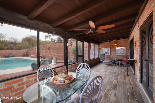 deck featuring wood ceiling, ceiling fan, and lofted ceiling with beams