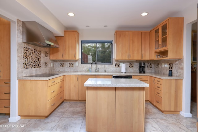 kitchen featuring sink, tasteful backsplash, ventilation hood, a kitchen island, and black electric cooktop