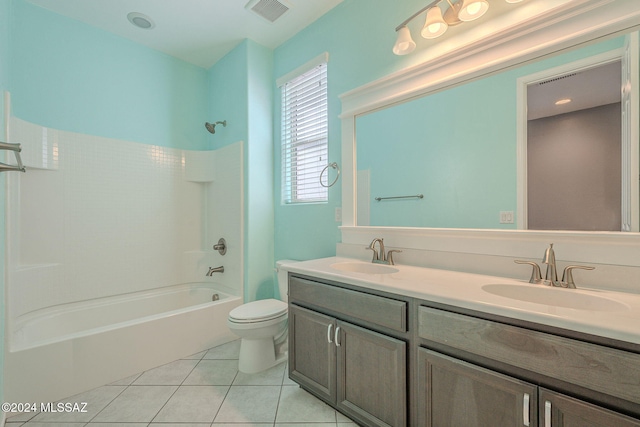 full bathroom featuring toilet, vanity, bathtub / shower combination, and tile patterned flooring